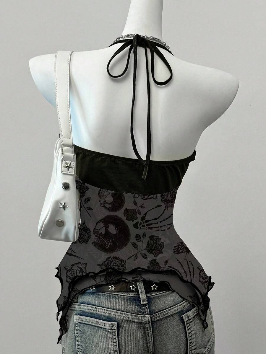 Women's backless halter cami top featuring a paisley print, sleeveless design, and an asymmetrical hem in knitted fabric.