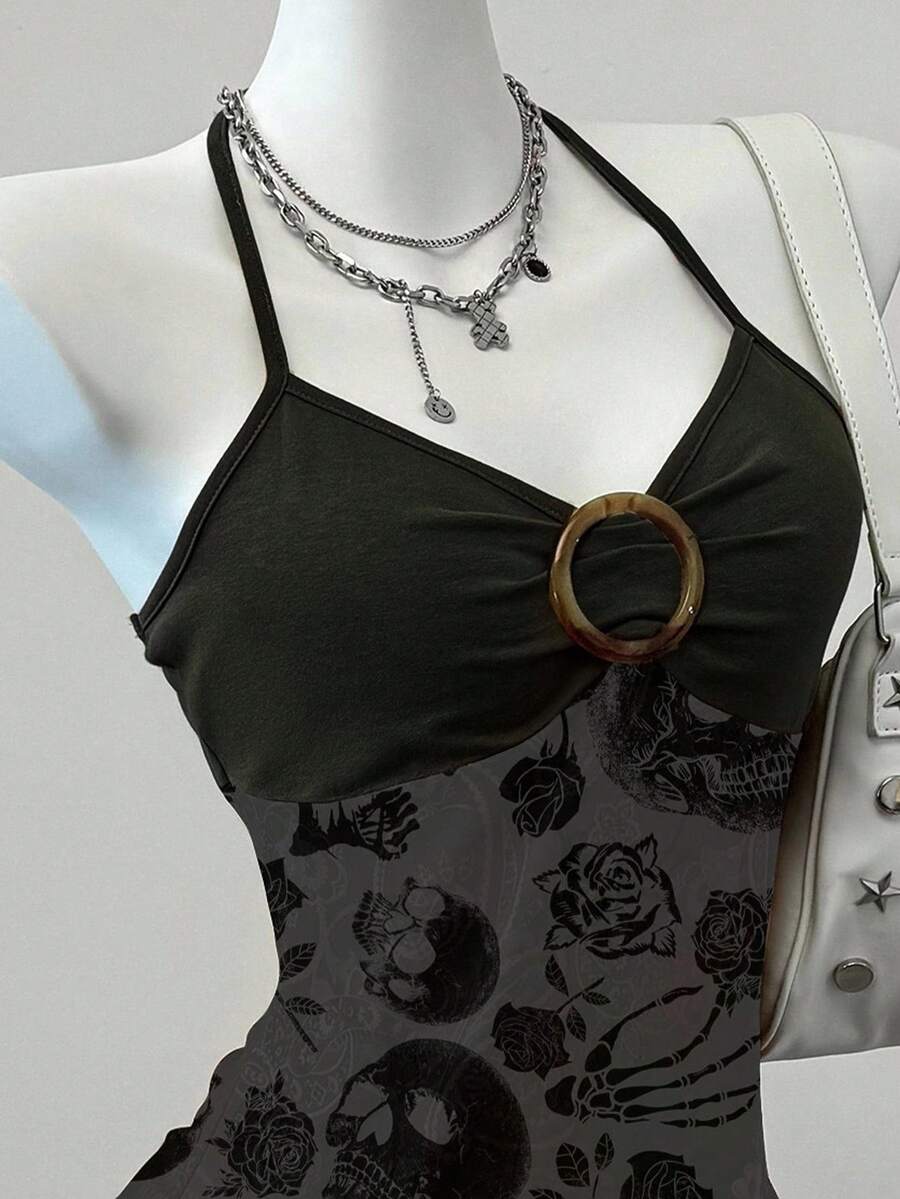 Women's backless halter cami top featuring a paisley print, sleeveless design, and an asymmetrical hem in knitted fabric.
