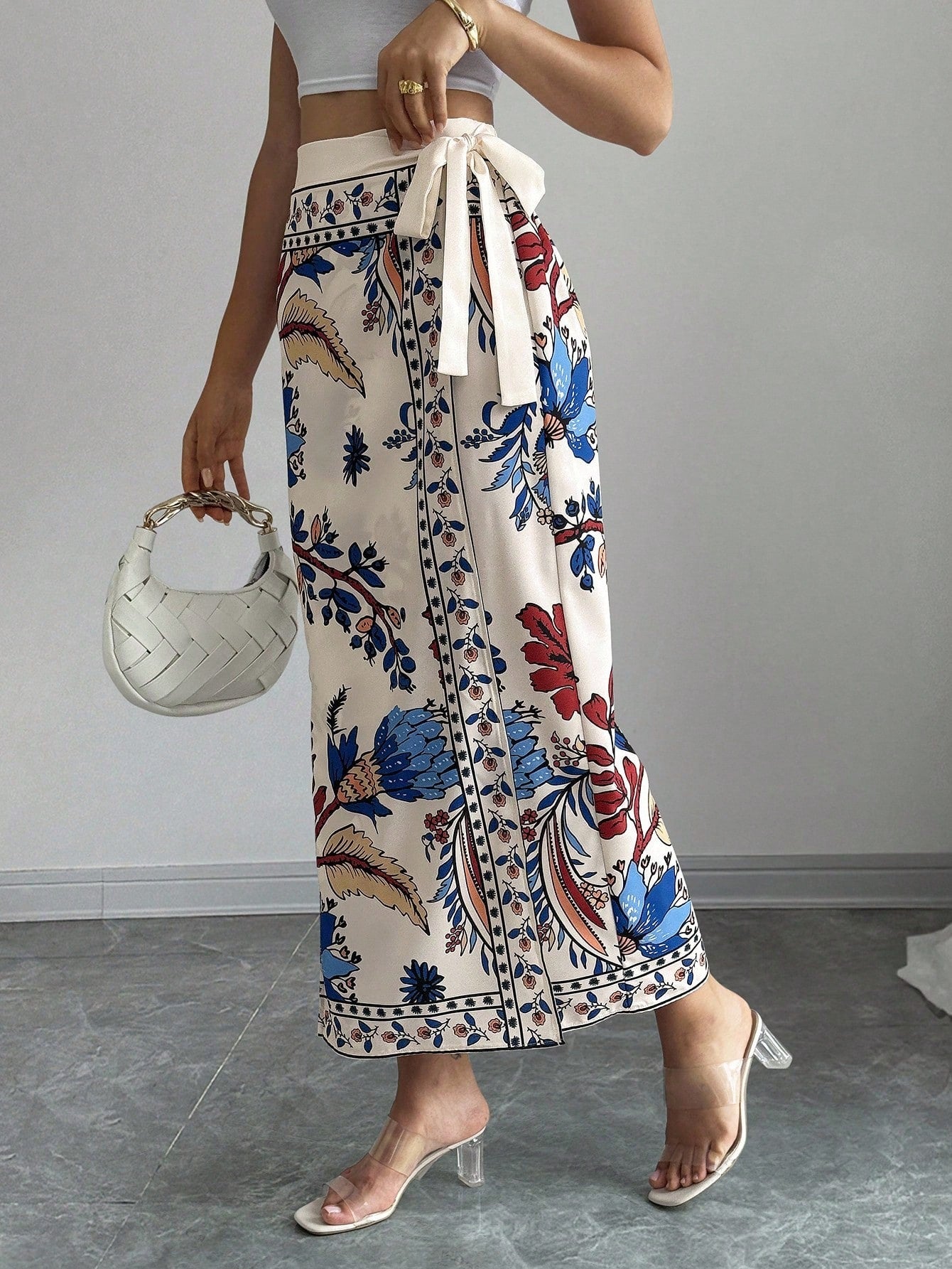 women's multicolor floral print wrap skirt featuring a high-waisted tie belt, A-line long silhouette, and boho woven fabric.