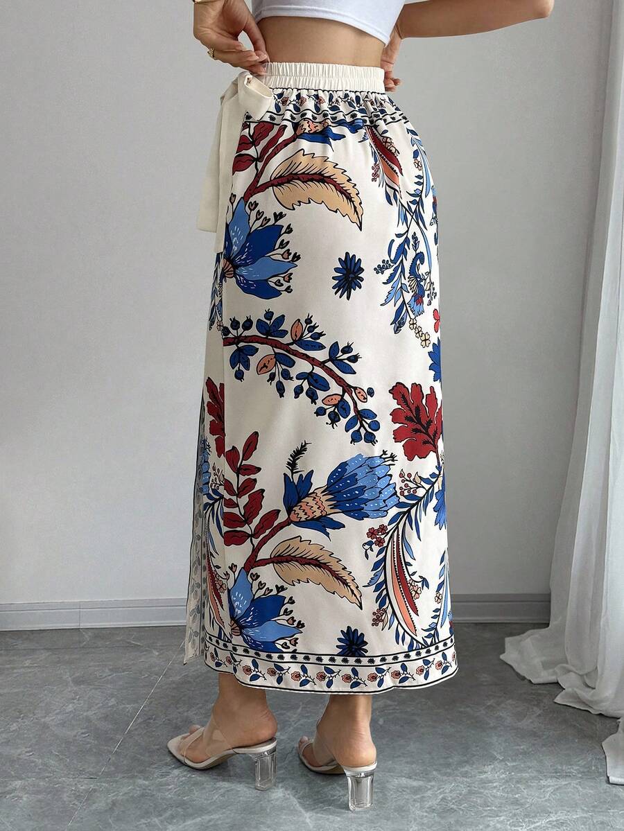 women's multicolor floral print wrap skirt featuring a high-waisted tie belt, A-line long silhouette, and boho woven fabric.