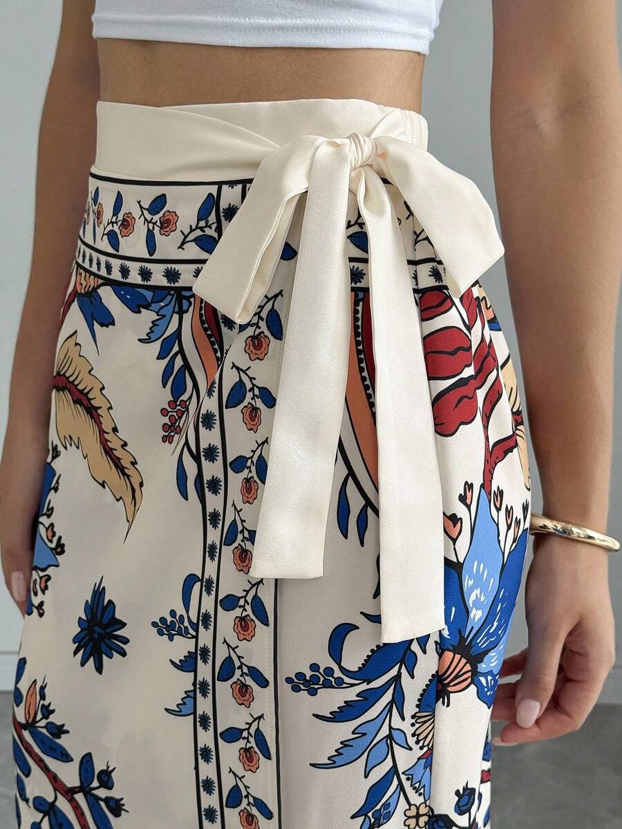 women's multicolor floral print wrap skirt featuring a high-waisted tie belt, A-line long silhouette, and boho woven fabric.