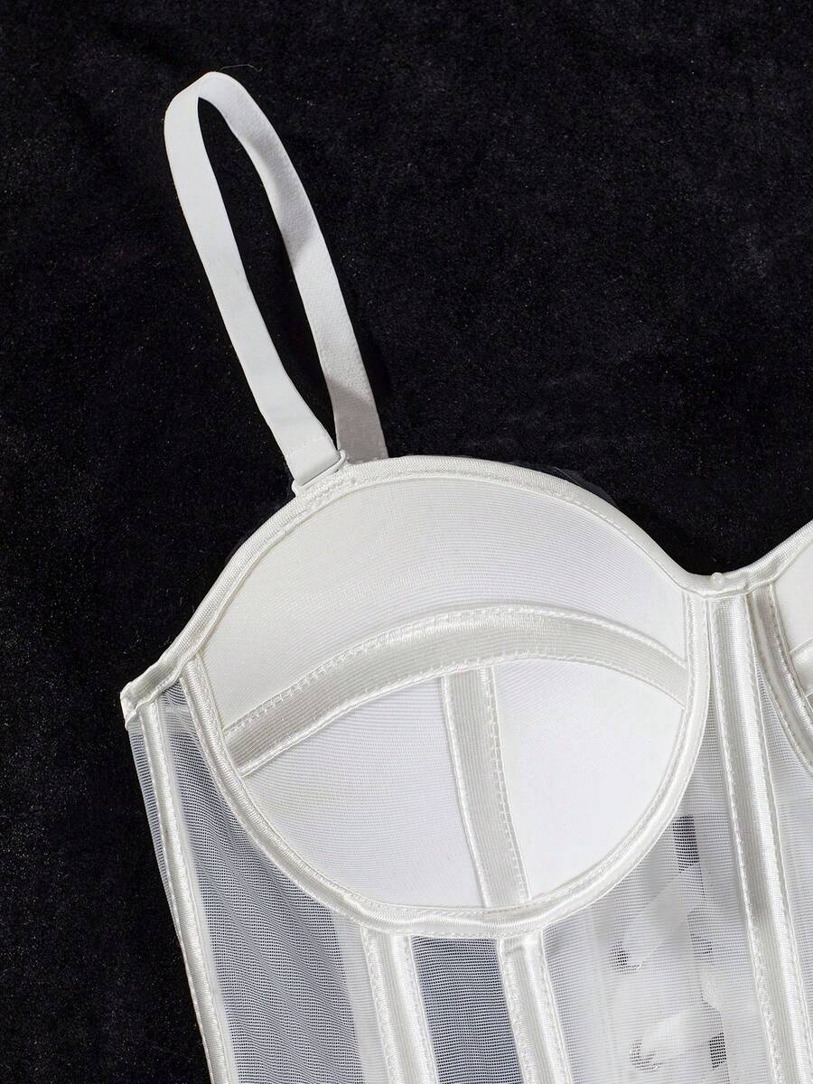 Beige strapless sheer mesh corset top for women featuring front boning, lace-up grommet eyelet detail, and push-up padded cups.