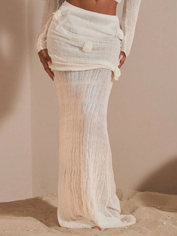 Beige women's knit maxi skirt featuring a pleated 3D floral pattern, low waist, skinny fit, and fishtail hem.
