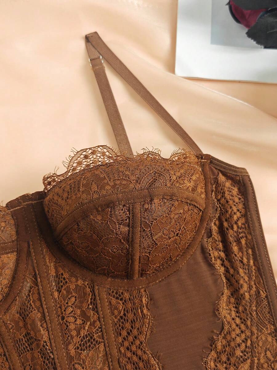 Women's brown lace trim cami corset crop top featuring a low cut neck, unlined body, and slim fit bodycon silhouette.