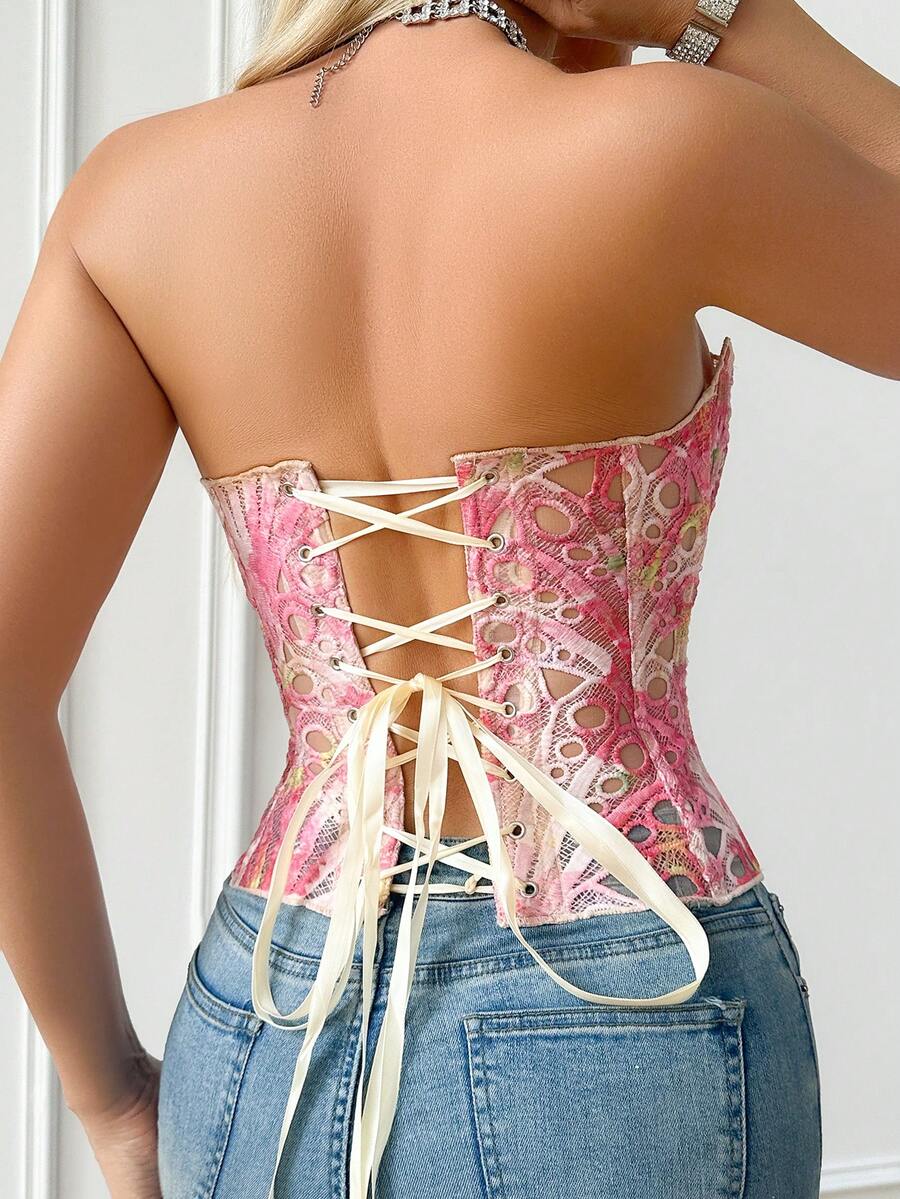 Black lace shaping camisole top with a tie-back detail and grommet eyelet accents, designed for women with slight stretch and ultra-light support.