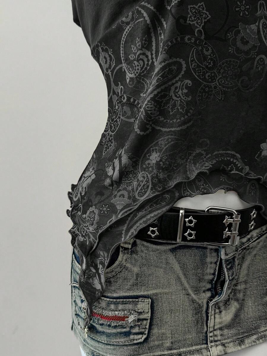 Women's backless halter cami top featuring a paisley print, sleeveless design, and an asymmetrical hem in knitted fabric.