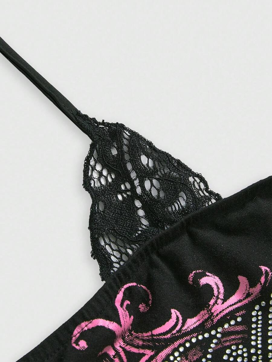 Woman wearing a black Y2K concert print 2-in-1 contrast lace halter crop top featuring a backless design with knot details.