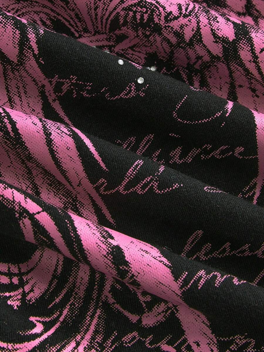 Woman wearing a black Y2K concert print 2-in-1 contrast lace halter crop top featuring a backless design with knot details.