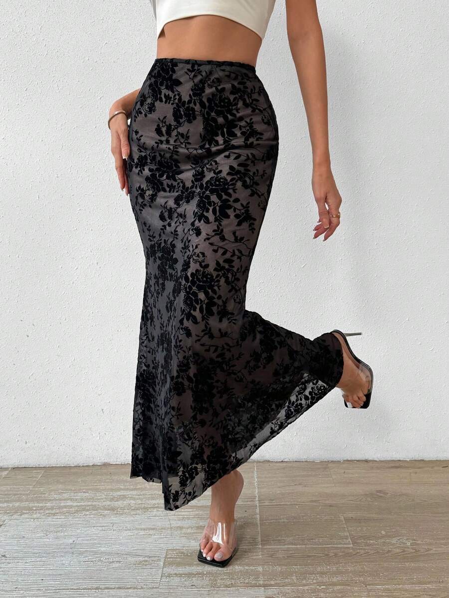 Women's black lace long mermaid skirt featuring lettuce trim, ruffle hem, random print pattern, low waist, and zipper detail.
