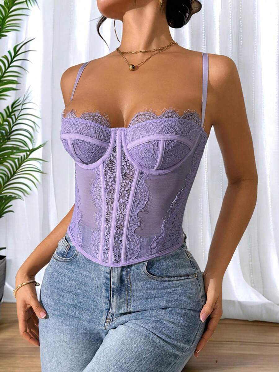 Front view of a black seamless lace camisole crop top featuring delicate spaghetti straps and intricate contrast lace detailing.