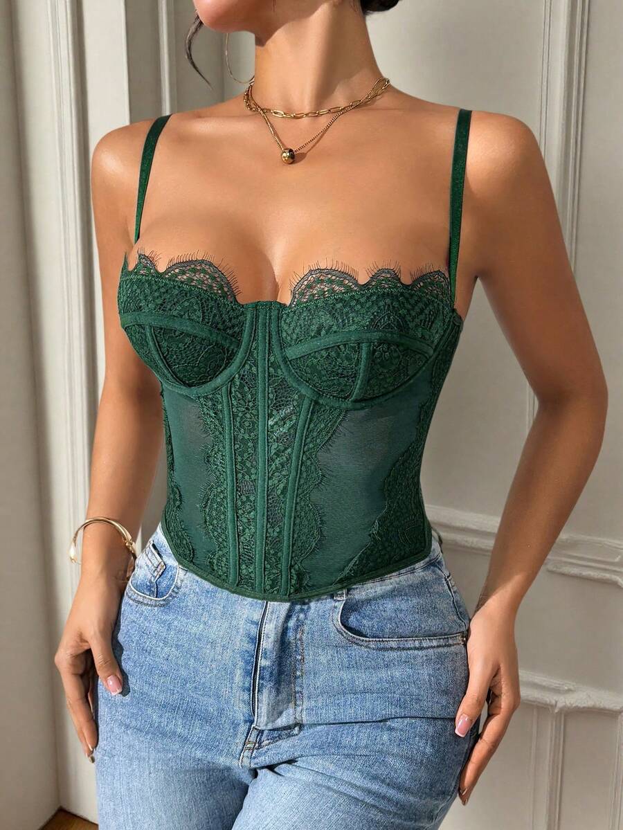 Front view of a black seamless lace camisole crop top featuring delicate spaghetti straps and intricate contrast lace detailing.
