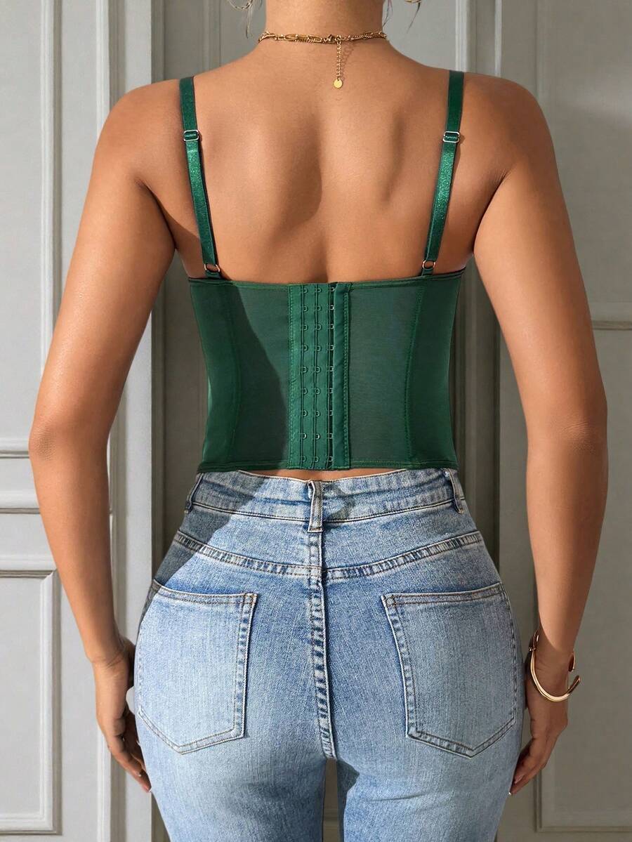 Front view of a black seamless lace camisole crop top featuring delicate spaghetti straps and intricate contrast lace detailing.
