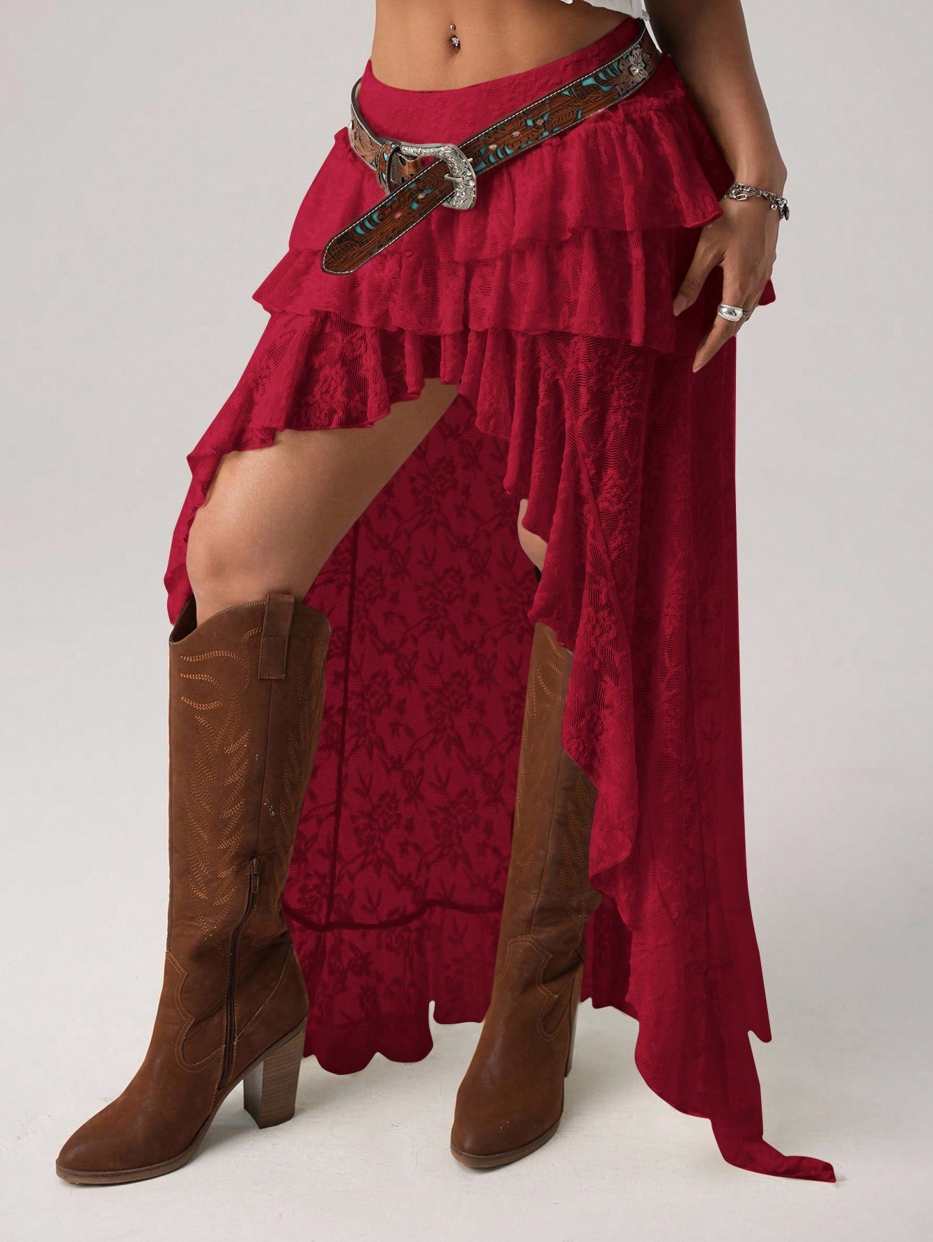 Women's lace tiered asymmetrical maxi skirt featuring a low waist and high slit thigh design.