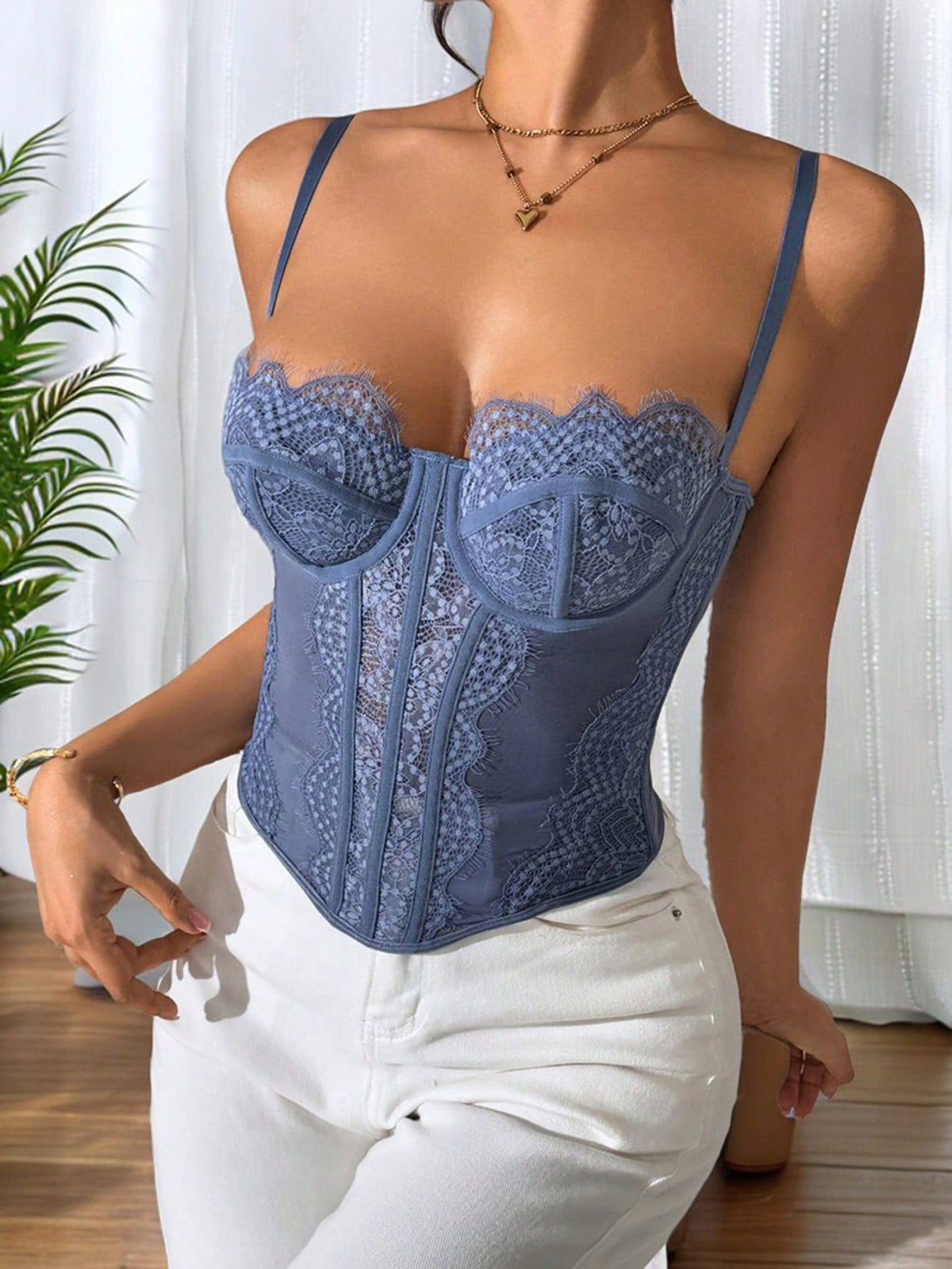 Women's brown lace trim cami corset crop top featuring a low cut neck, unlined body, and slim fit bodycon silhouette.