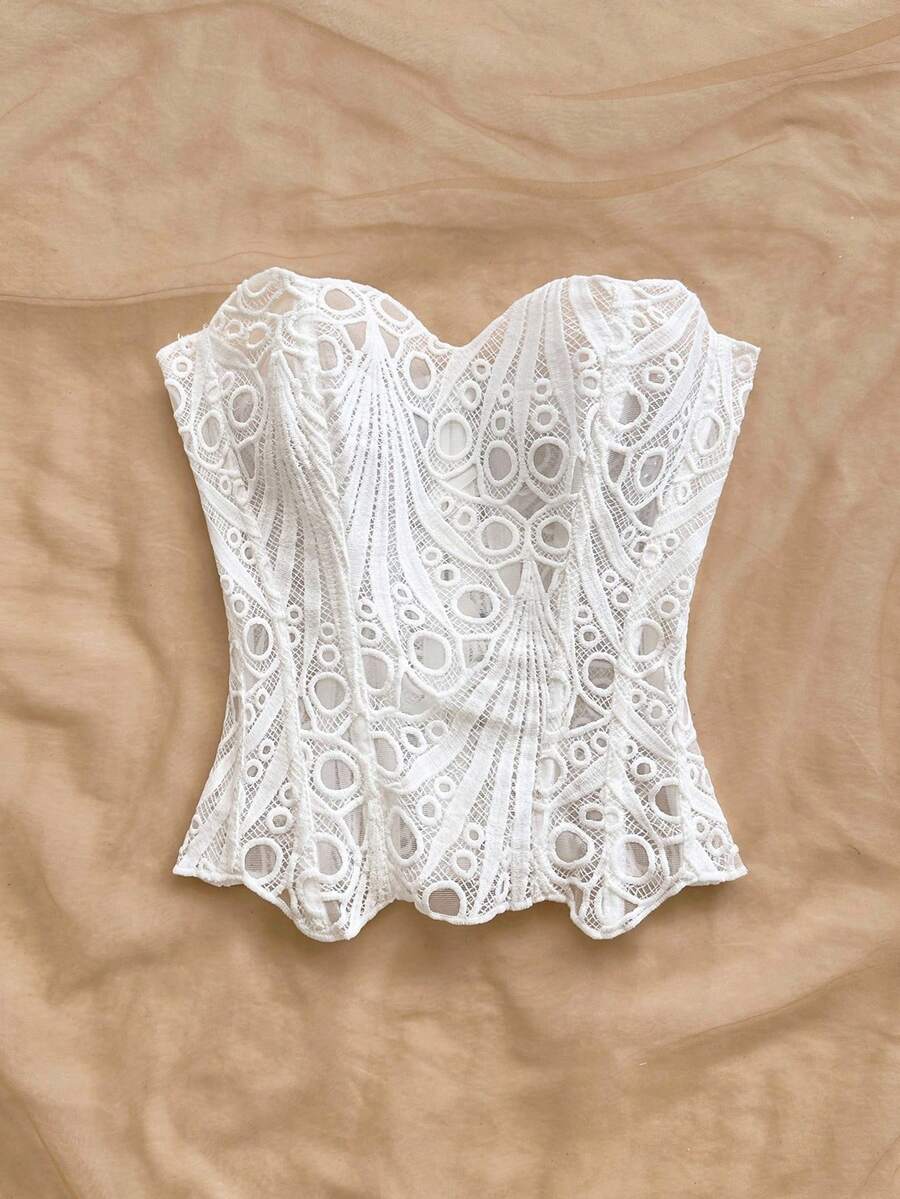 Women’s strapless corset bustier top with lace-up detail, asymmetrical embroidery, semi-sheer finish, and slim fit.