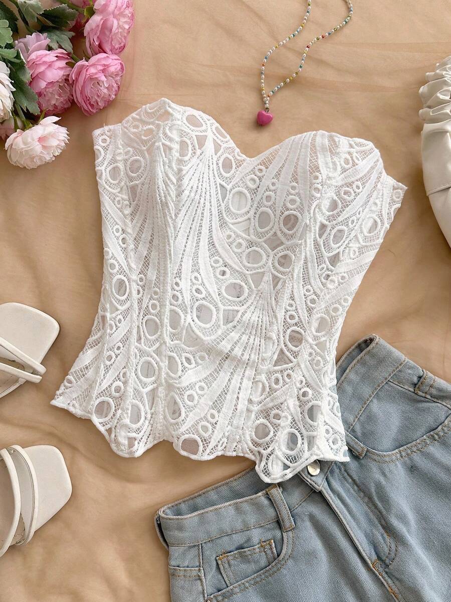 Women’s strapless corset bustier top with lace-up detail, asymmetrical embroidery, semi-sheer finish, and slim fit.