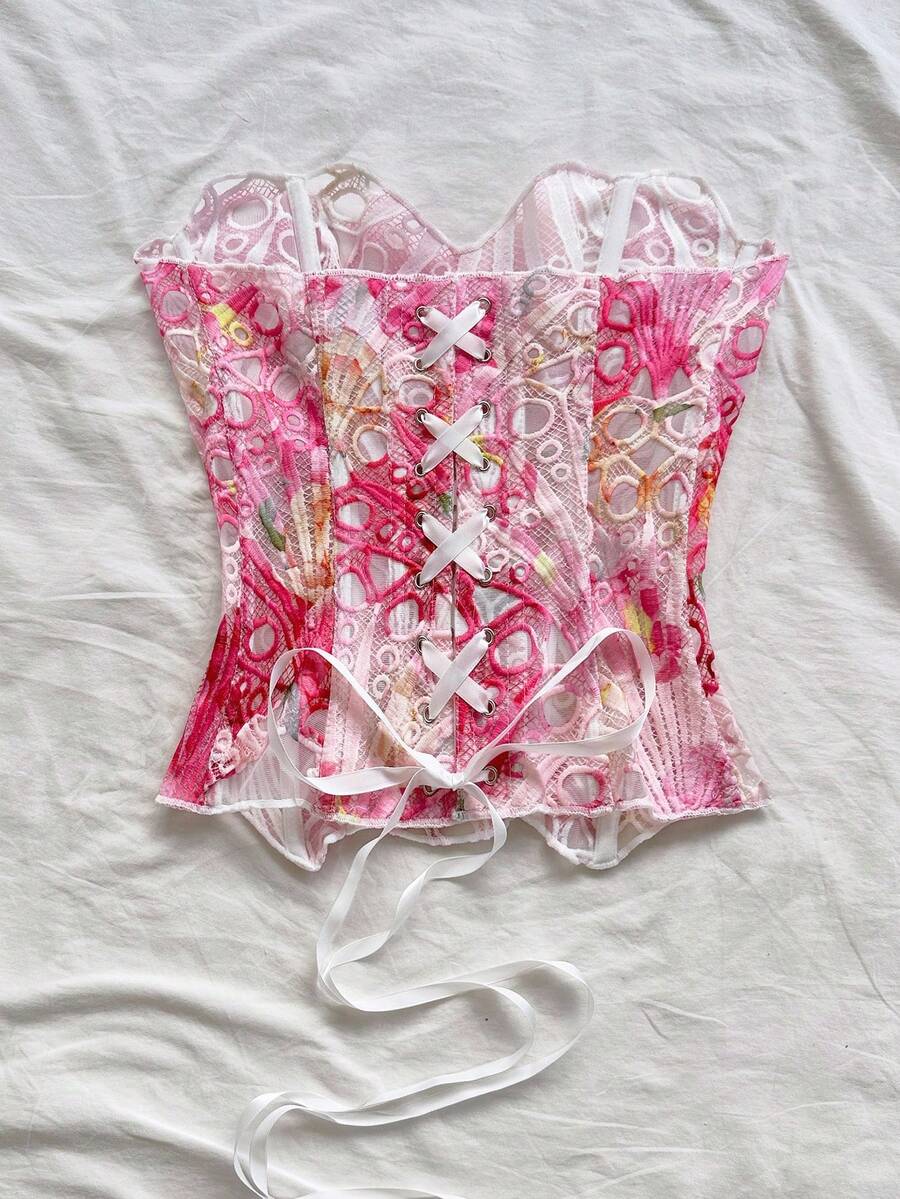 Strapless floral lace corset top with lace-up detail, asymmetrical hem, and slim fit for women.