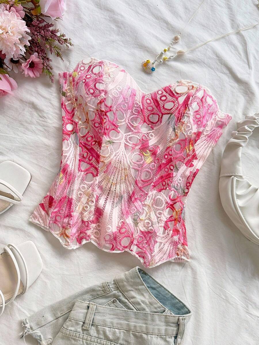 Strapless floral corset top with lace-up detail, asymmetrical hem, and slim fit for women in a boho vacation style.