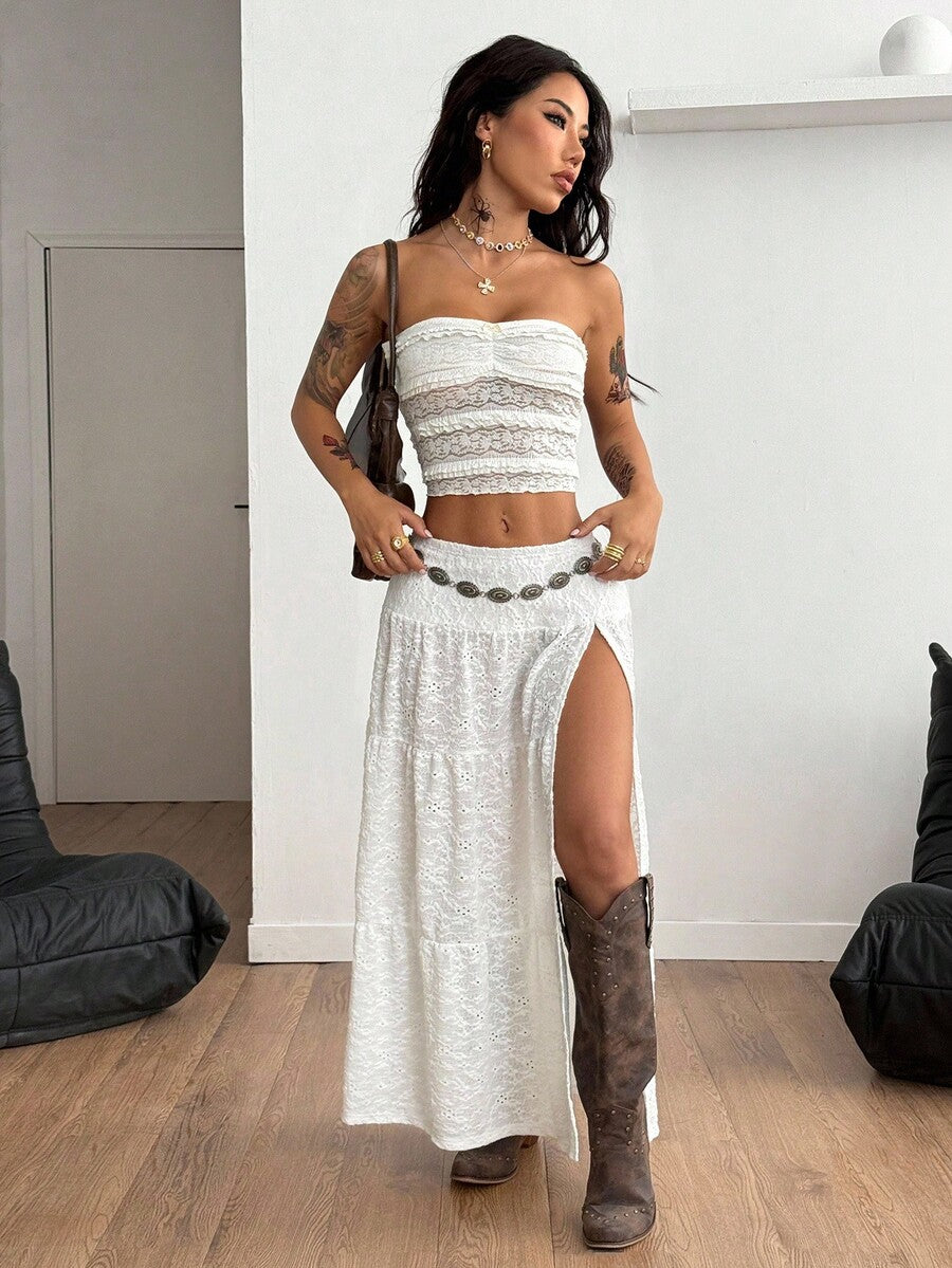 Women's black low waist split thigh long skirt featuring semi-sheer textured fabric and a flared skinny fit.