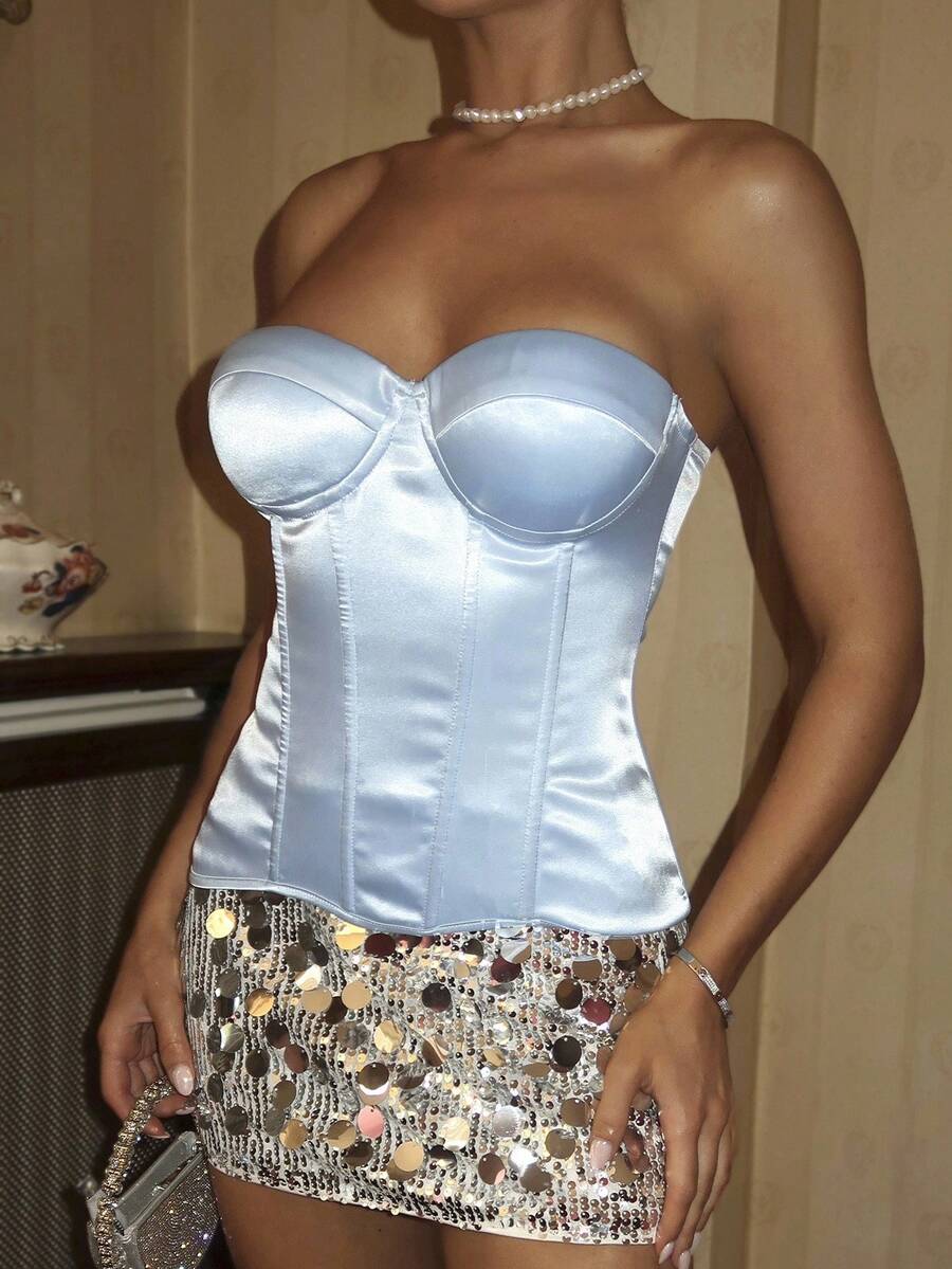 Women's brown strapless bustier crop top featuring a lace-up backless design with grommet eyelets and a boned corset fit.
