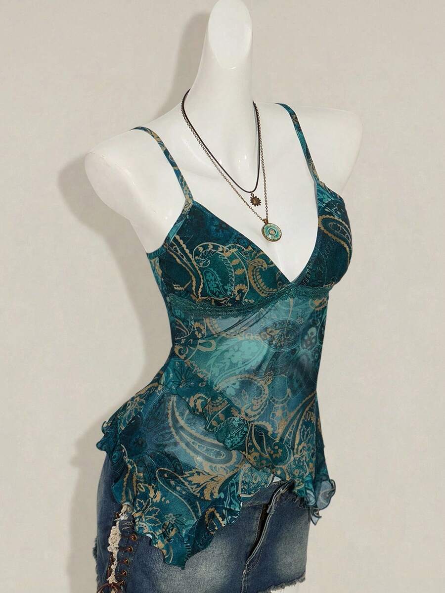 Women's burgundy floral graphic print mesh camisole top featuring an asymmetrical hem, backless cut, and spaghetti straps.