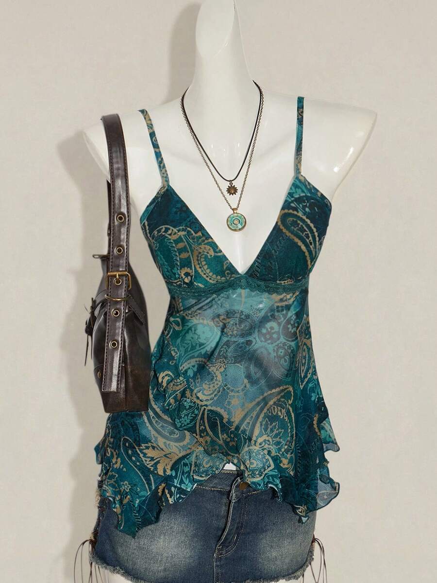 Women's burgundy floral graphic print mesh camisole top featuring an asymmetrical hem, backless cut, and spaghetti straps.