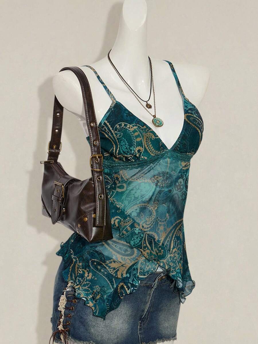 Women's burgundy floral graphic print mesh camisole top featuring an asymmetrical hem, backless cut, and spaghetti straps.