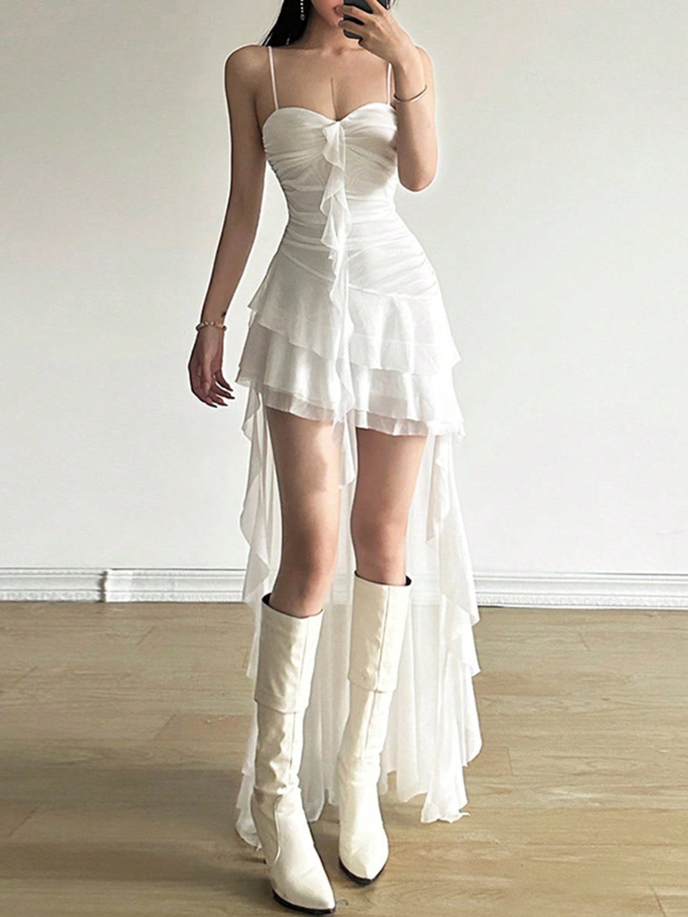 Women's white off shoulder asymmetrical camisole midi dress featuring a fitted high waist and sleeveless knitted design.