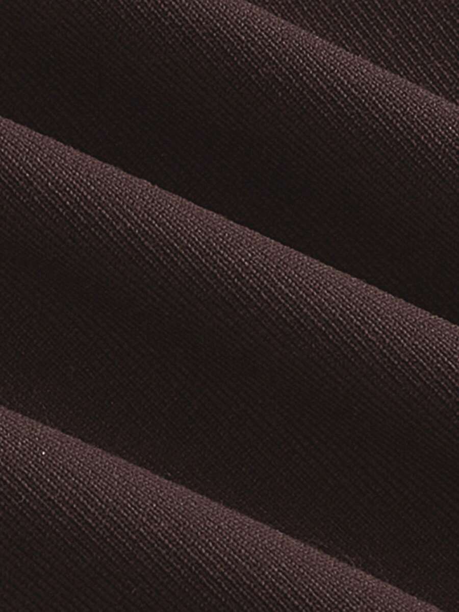 Women's black casual low rise bodycon mini skort with built-in shorts in knitted plain stretch fabric.