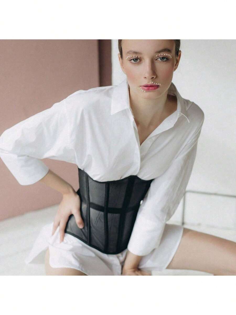 Women's apricot mesh shaping short corset with a lace-up front detail and slim-fit waist shaper design.
