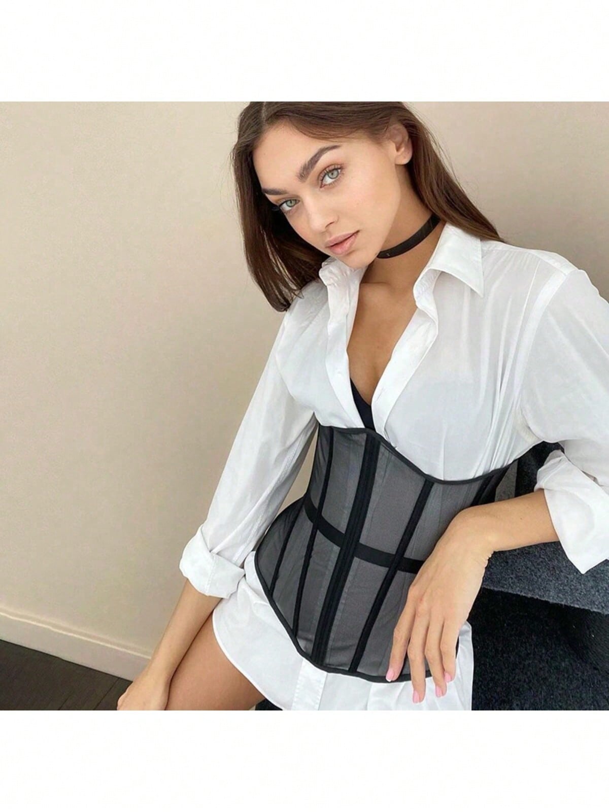 Women's apricot mesh shaping short corset with a lace-up front detail and slim-fit waist shaper design.