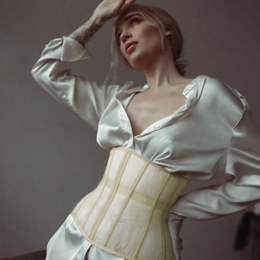 Women's apricot mesh shaping short corset with a lace-up front detail and slim-fit waist shaper design.