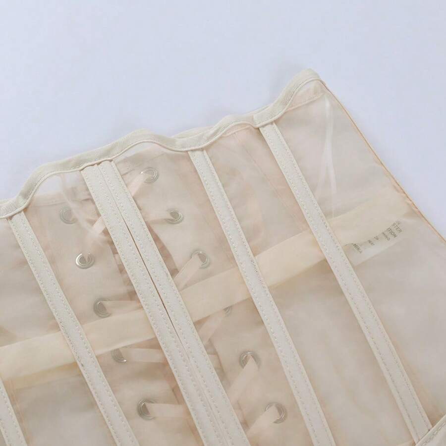 Women's apricot mesh shaping short corset with a lace-up front detail and slim-fit waist shaper design.