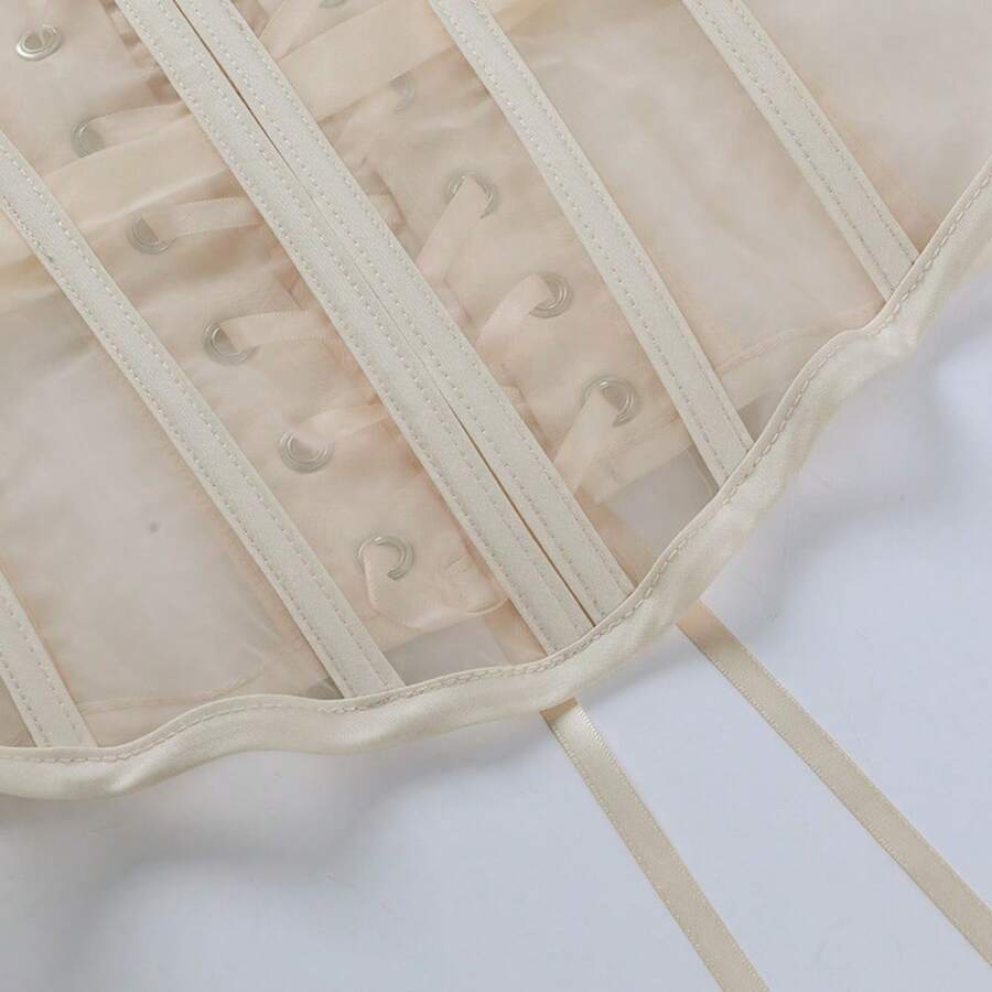 Women's apricot mesh shaping short corset with a lace-up front detail and slim-fit waist shaper design.