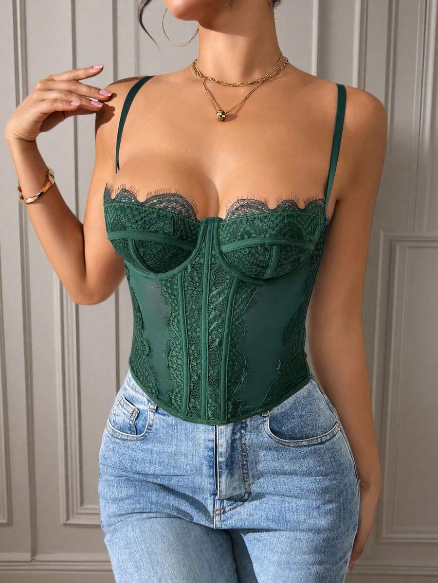 Front view of a black seamless lace camisole crop top featuring delicate spaghetti straps and intricate contrast lace detailing.