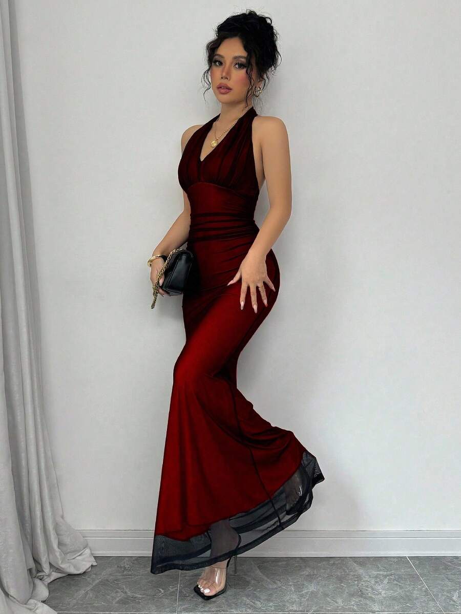 Women's long sleeve mermaid bodycon dress in high-stretch mesh fabric featuring a halter backless neckline, ruched high waist, and slim fit silhouette for formal evening wear.