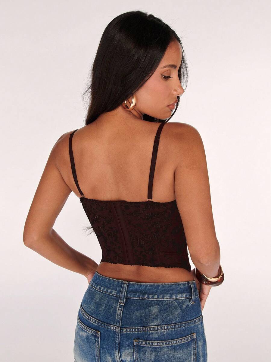 Women’s camisole top with cup detail, spaghetti straps, lined body, and slim fit design in knitted fabric with an asymmetrical hem.