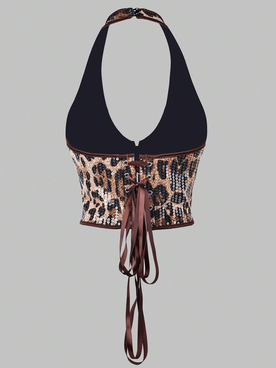 Women's leopard print backless halter crop top featuring front grommet lace-up detailing and slim fit crop silhouette.