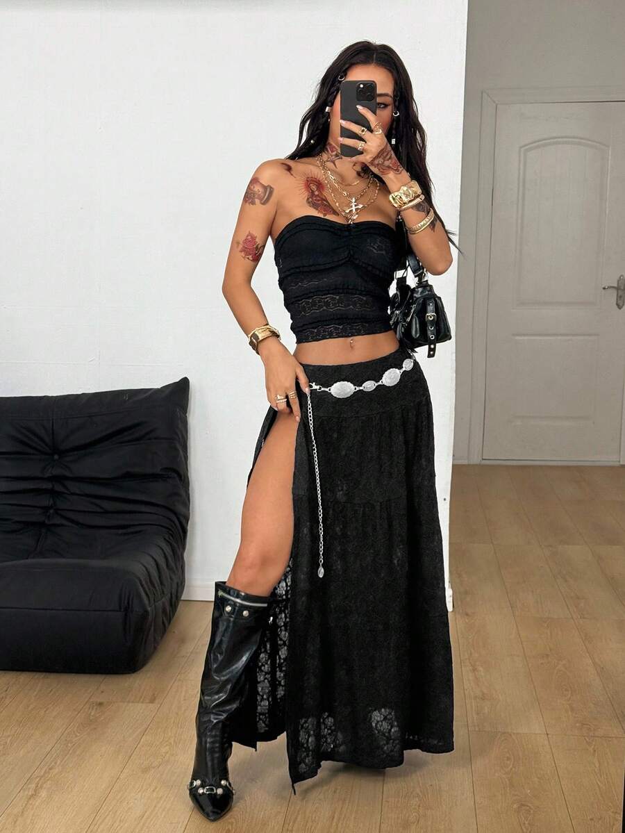 Women's black low waist split thigh long skirt featuring semi-sheer textured fabric and a flared skinny fit.
