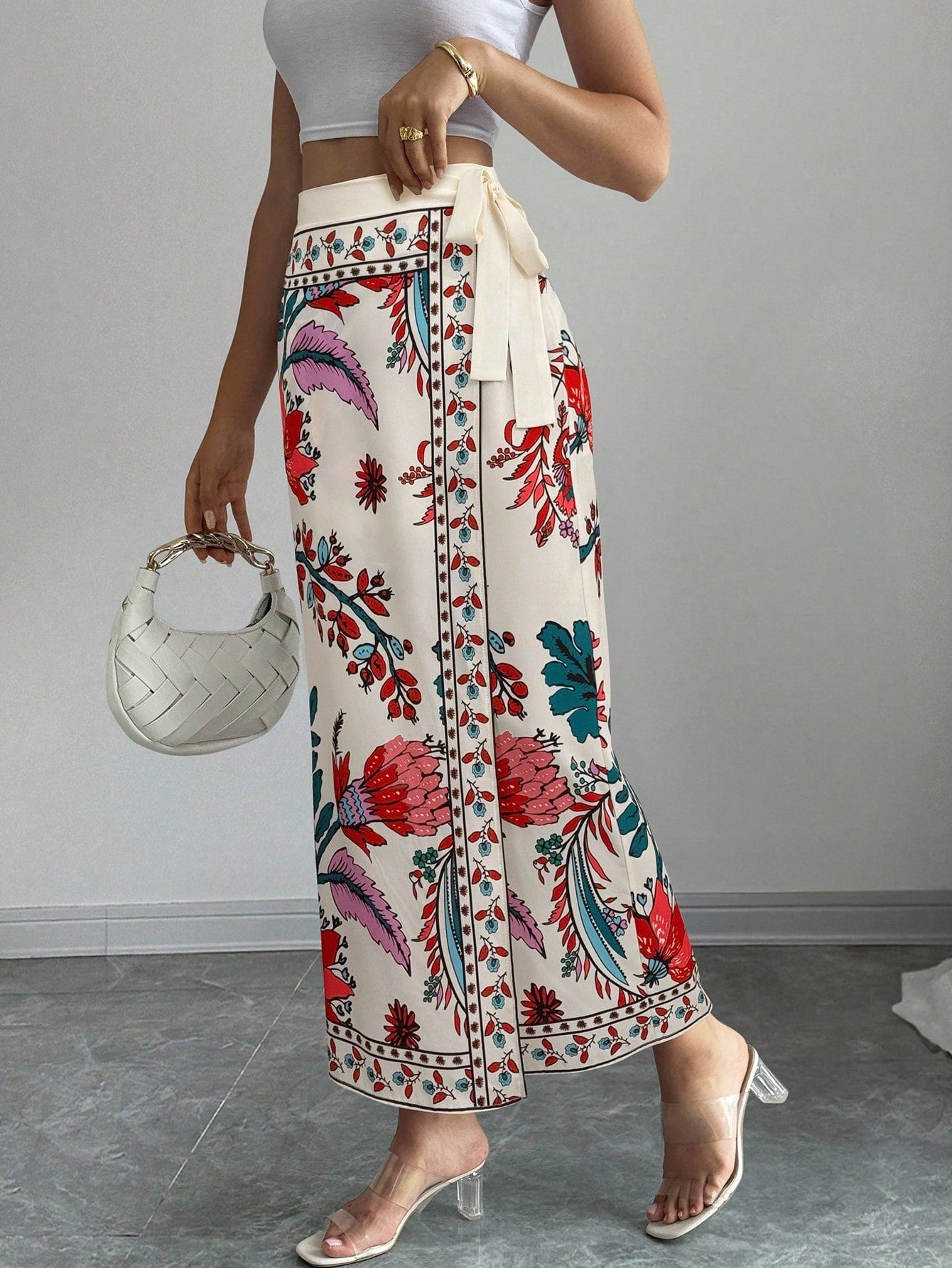 women's multicolor floral print wrap skirt featuring a high-waisted tie belt, A-line long silhouette, and boho woven fabric.