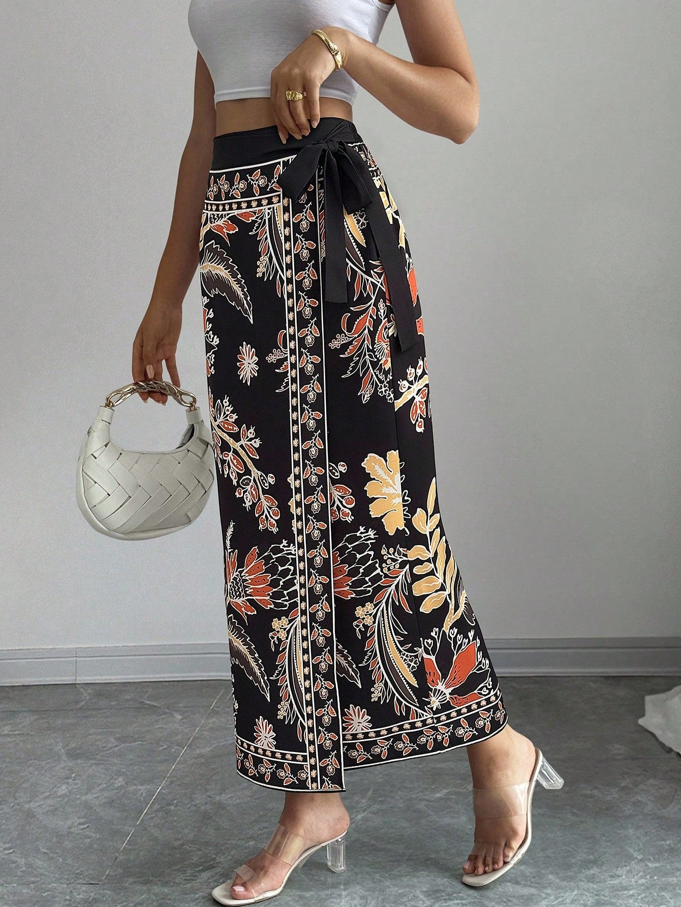 women's multicolor floral print wrap skirt featuring a high-waisted tie belt, A-line long silhouette, and boho woven fabric.