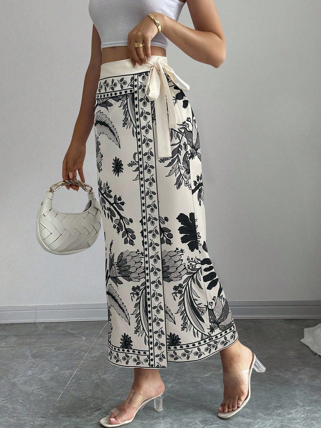 women's multicolor floral print wrap skirt featuring a high-waisted tie belt, A-line long silhouette, and boho woven fabric.