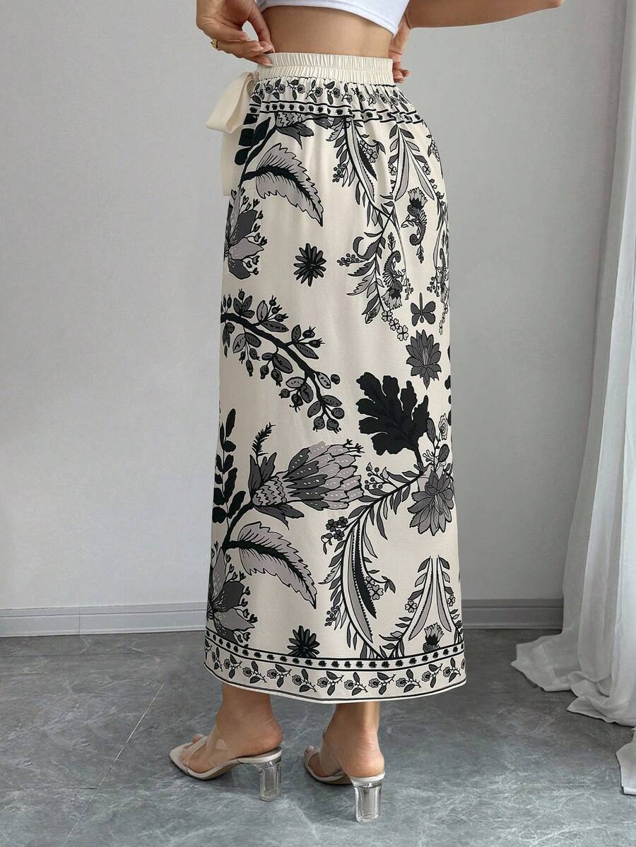 women's multicolor floral print wrap skirt featuring a high-waisted tie belt, A-line long silhouette, and boho woven fabric.