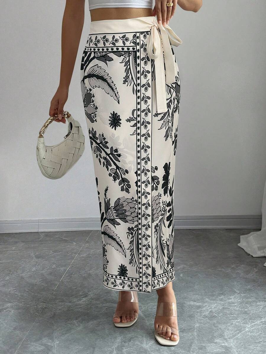 women's multicolor floral print wrap skirt featuring a high-waisted tie belt, A-line long silhouette, and boho woven fabric.
