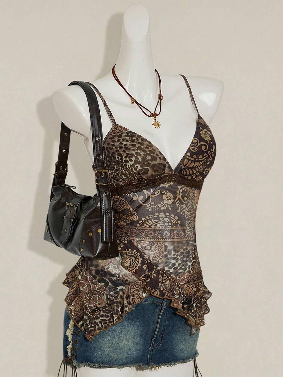 Women's burgundy floral graphic print mesh camisole top featuring an asymmetrical hem, backless cut, and spaghetti straps.