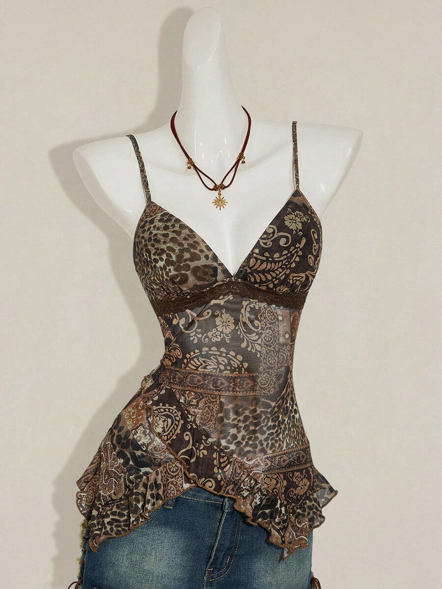 Women's burgundy floral graphic print mesh camisole top featuring an asymmetrical hem, backless cut, and spaghetti straps.