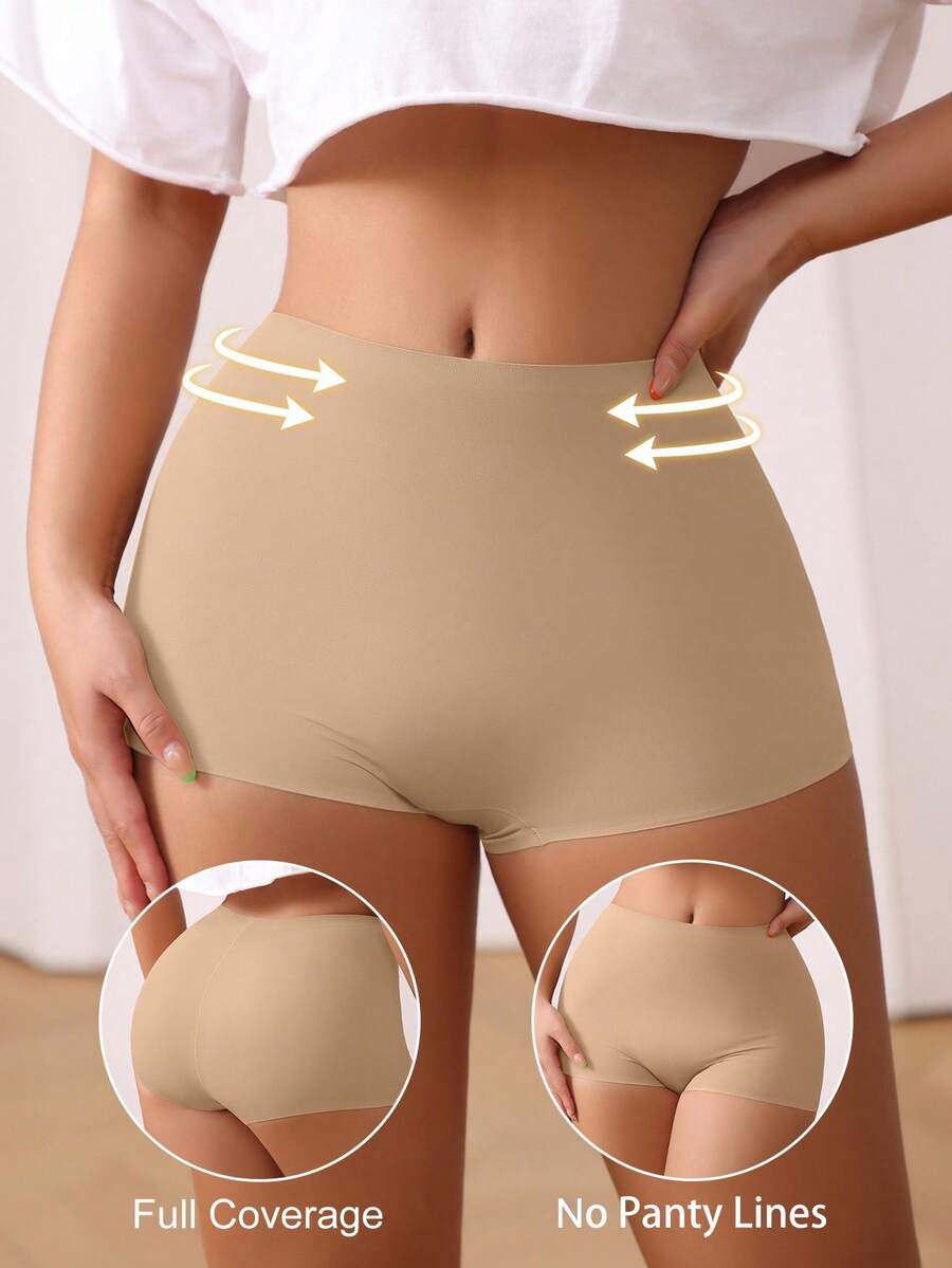 Women's black high stretch shapewear shorts with a mid waist fit and semi-sheer fabric.