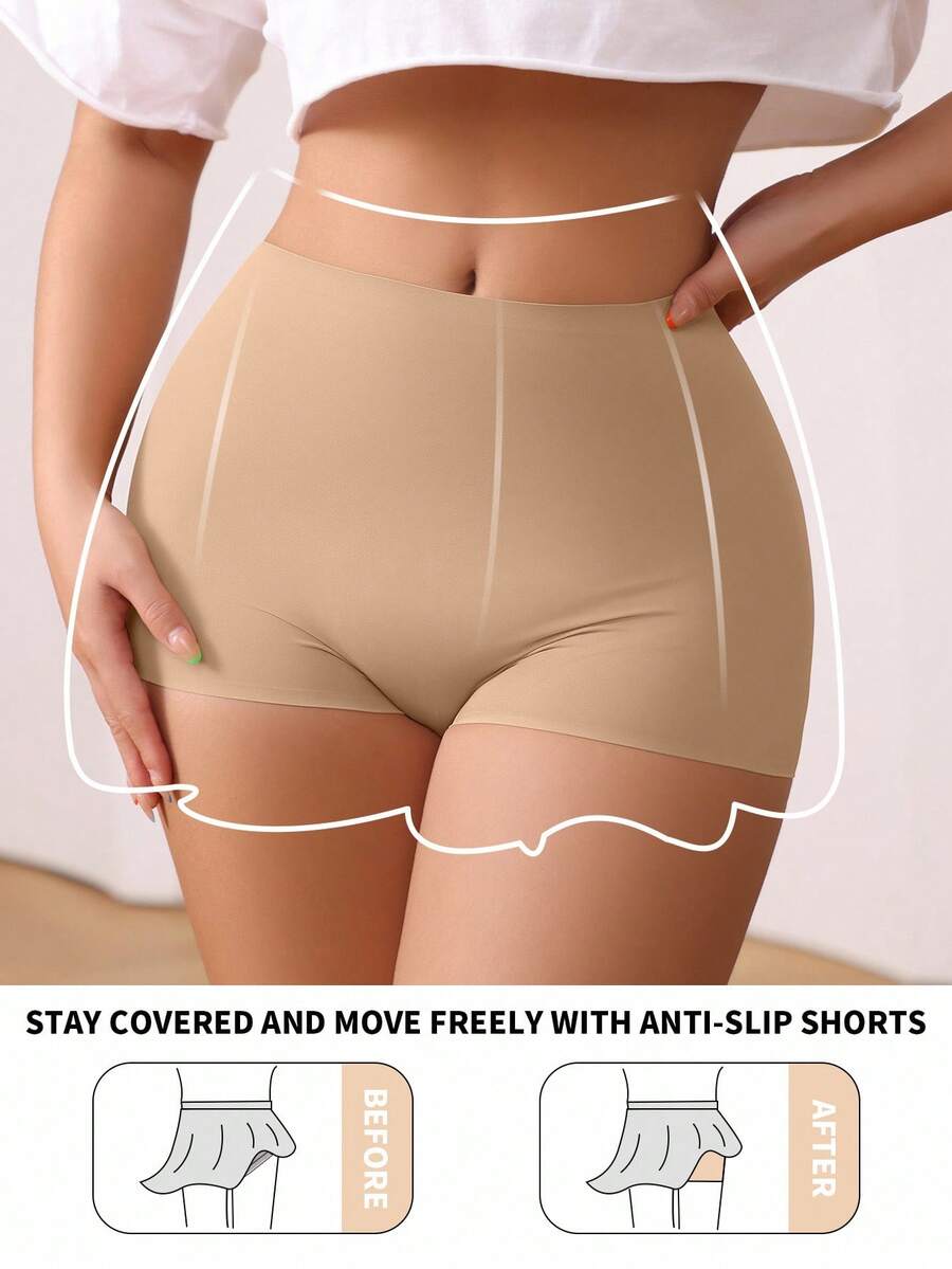 Women's black high stretch shapewear shorts with a mid waist fit and semi-sheer fabric.