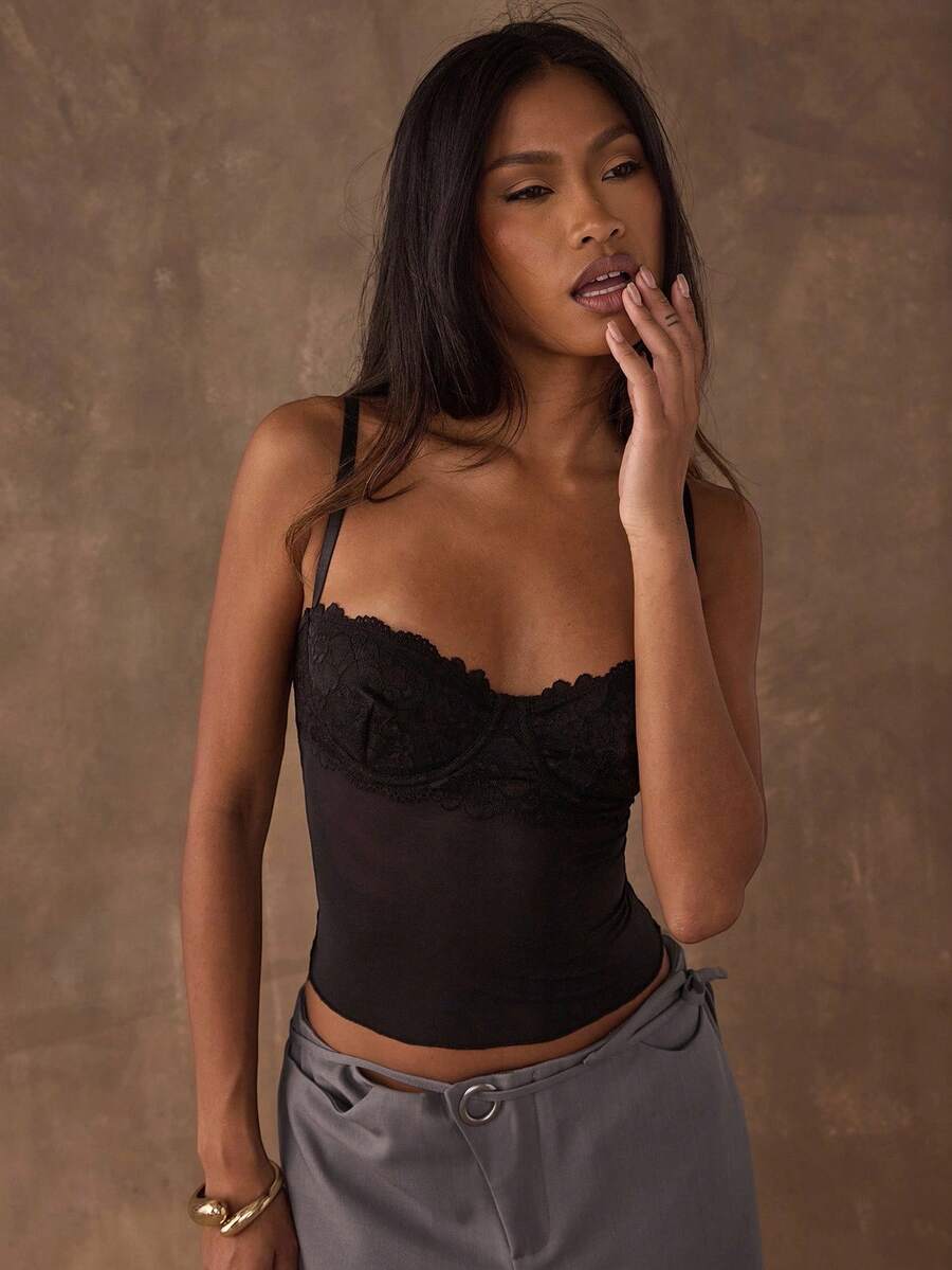 Women's black contrast lace camisole with spaghetti straps, cup detail, semi-sheer finish, and slim fit for going out or date night.