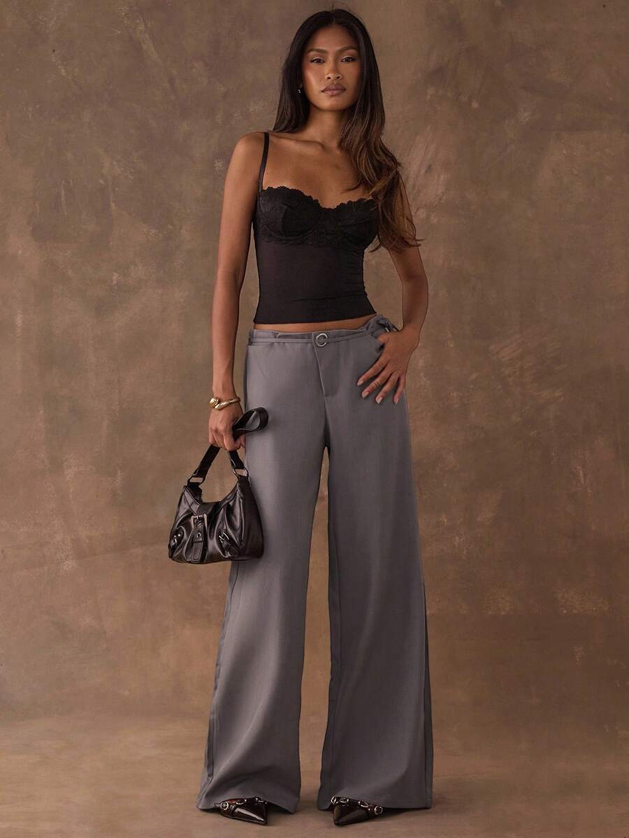 Women's black contrast lace camisole with spaghetti straps, cup detail, semi-sheer finish, and slim fit for going out or date night.